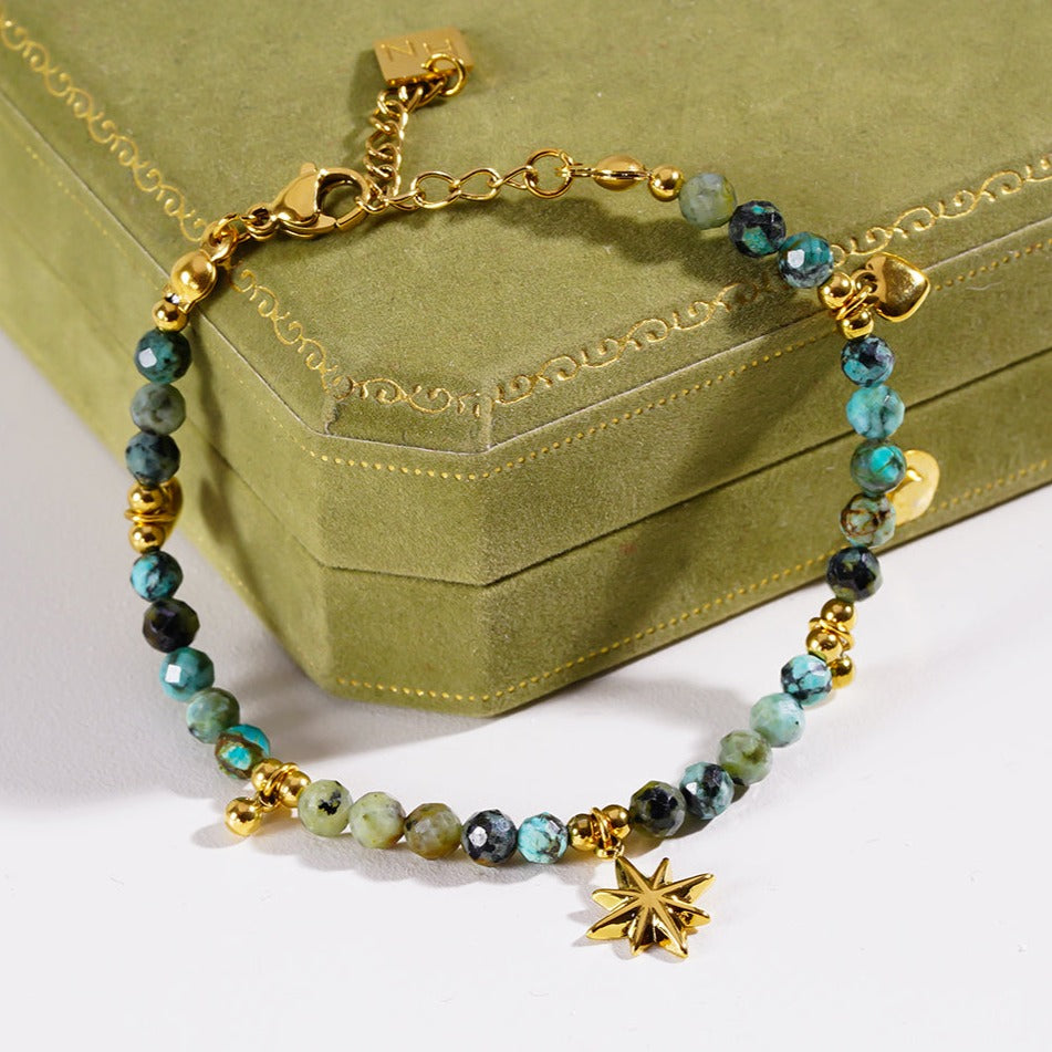 Style KAVYA: Blue Turquoise Stones with Gold Beads & Charms Chain Bracelet HACKNEY NINE Jewellery
